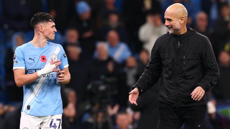 MManchester City Manager Pep Guardiola celebrates the 3-0 win with Phil Foden
