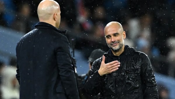 MANCHESTER, ENGLAND - FEBRUARY 23: Pep Guardiola, Manager of Manchester City, (R) reacts as Arne Slot, Manger of Liverpool looks on, after the Premier League match between Manchester City FC and Liverpool FC at Etihad Stadium on February 23, 2025 in Manch