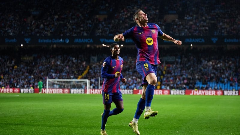Robert Lewandowski celebrates one of his three goals against Celta Vigo