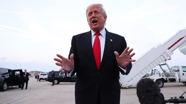 Donald Trump gives brief remarks to members of the press