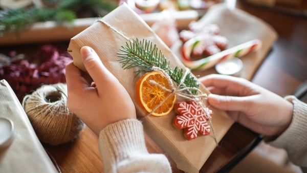Young woman at home with Christmas presents