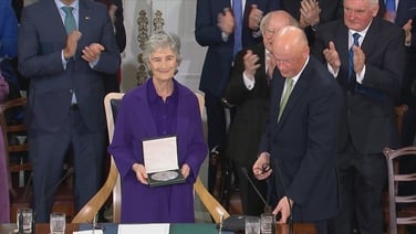 The moment Catherine Connolly is presented with the presidential seal