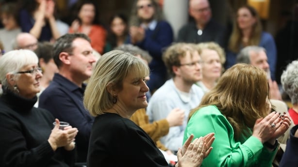 crowd applauds at the launch of Sunday Miscellany book