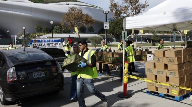 LOS ANGELES, CALIFORNIA - NOVEMBER 11: Free food boxes are distributed near the Lucas Museum of Narrative Art at a large-scale food distribution, in response to the federal government shutdown and SNAP/CalFresh food benefits delays, on November 11, 2025 in Los Angeles, California. The event was host