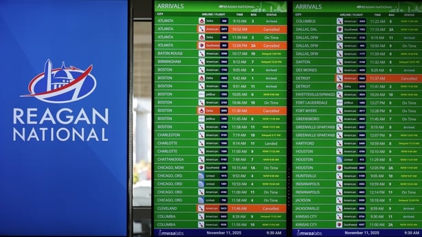 ARLINGTON, VIRGINIA - NOVEMBER 11: Flight cancellations are shown on a bulletin board at Ronald Reagan Washington National Airport on November 11, 2025 in Arlington, Virginia. The FAA announced last week that flights will be reduced by up to 10% at 40 airports across the country due to a shortage of