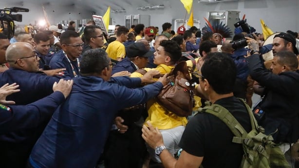 People clash during a summit