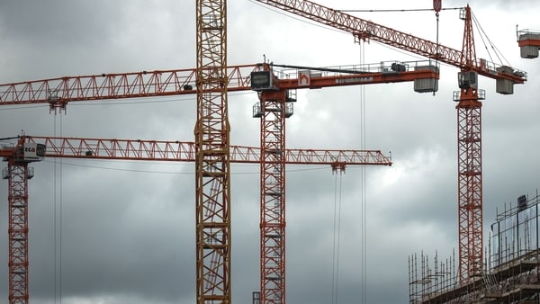 A view of a construction cranes over the construction site of the Salesforce Tower Dublin in Dublin's Docklands