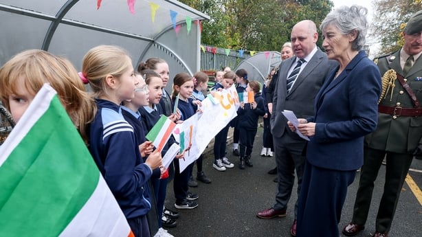 President Connolly greets students at Gaelscoil Inse Chor 