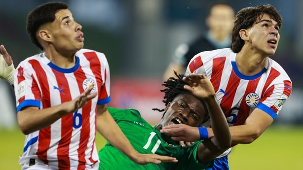 Jaden Umeh is sandwiched by Paraguay defenders Luis Hector Cristaldo, left, and Juan Miguel Ojeda