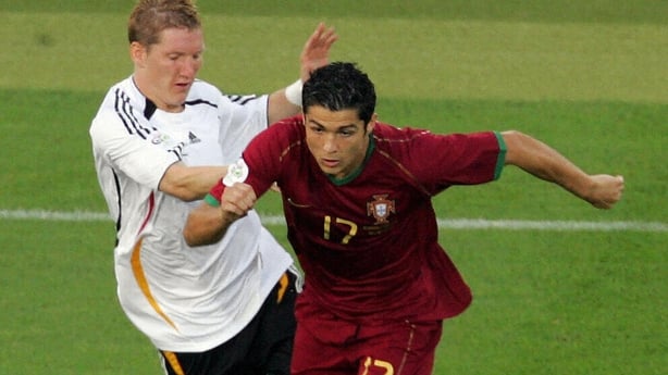 German midfielder Bastian Schweinsteiger (L) fights for the ball with Portuguese forward Cristiano Ronaldo 08 July 2006 at the Stuttgart stadium, during the World Cup third-place play-off football match between Germany and Portugal. AFP PHOTO / DDP / JUERGEN SCHWARZ (Photo credit should read JUERGEN