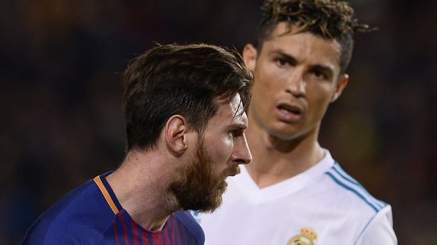  Real Madrid's Portuguese forward Cristiano Ronaldo (R) looks at Barcelona's Argentinian forward Lionel Messi during the Spanish league football match between FC Barcelona and Real Madrid CF at the Camp Nou stadium in Barcelona on May 6, 2018. (Photo by Josep LAGO / AFP) (Photo credit should read