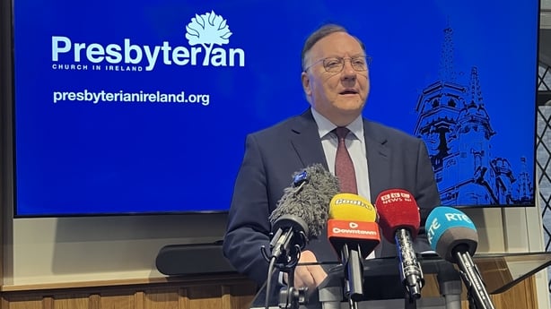 Dr Trevor Gribben speaking in front of media