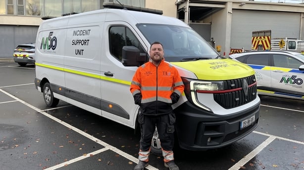 M50 unit supervisor Ryan Mulroy stands in front of a van.