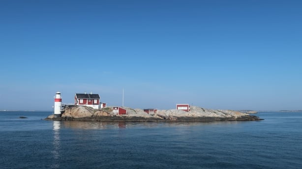 An island in the middle of a blue sea