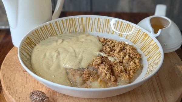 A bowl of crumble and custard