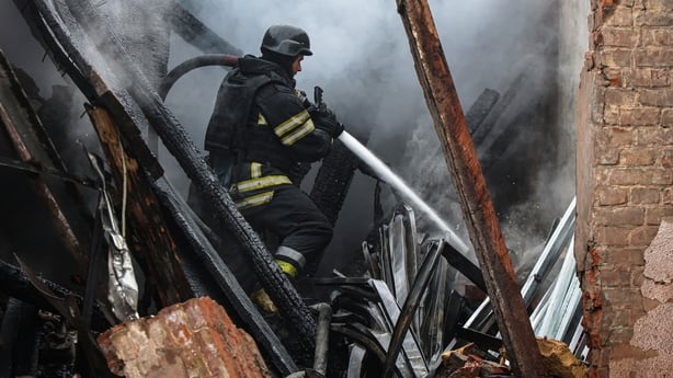 A rescuer of the Ukrainian State Emergency Service puts out a fire at a civilian enterprise in the Kholodnohirskyi district, destroyed by a Russian drone attack, in Kharkiv, Ukraine, on November 12, 2025. (Photo by Viacheslav Madiievskyi/Ukrinform/NurPhoto via Getty Images) NO USE RUSSIA. NO USE BEL