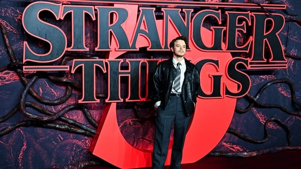 Charlie Heaton poses on the red carpet