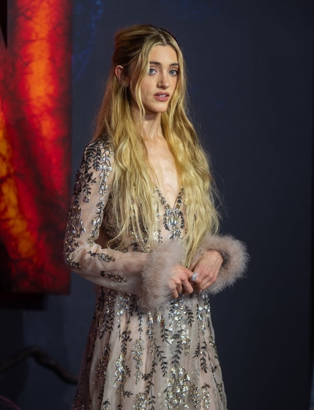 Natalia Dyer poses on the red carpet