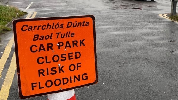 A sign reading 'car park closed risk of flooding'