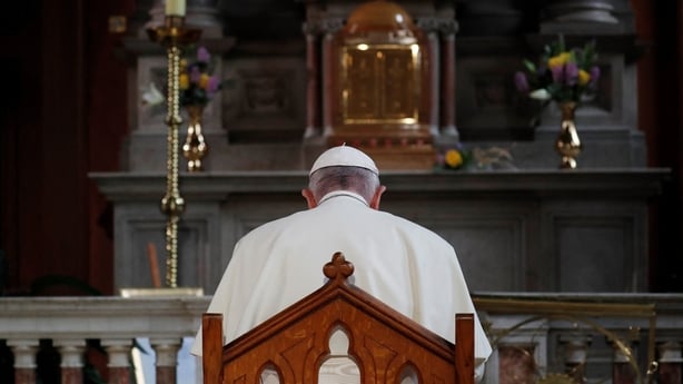 Pope Francis is pictured praying at St Mary's Pro-Cathedral in Dublin 