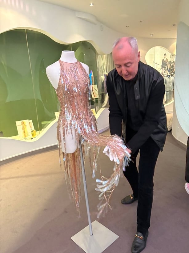 A photo of a nude embellished bodysuit on a mannequin