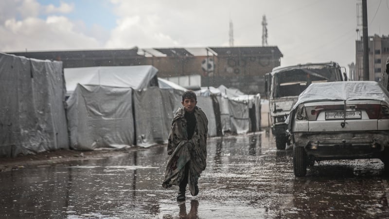 Palestinians, whose homes were destroyed in Israeli attacks, struggle as their tents flood with intense rain