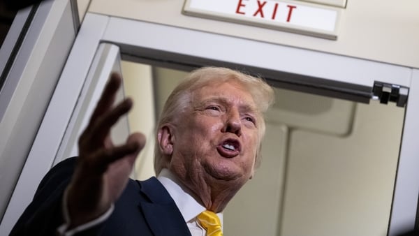 IN FLIGHT - NOVEMBER 14: U.S. President Donald Trump speaks to members of press aboard Air Force One on November 14, 2025 while in flight from Washington, DC to West Palm Beach International Airport. Trump is scheduled to spend the weekend at his Mar-A-La