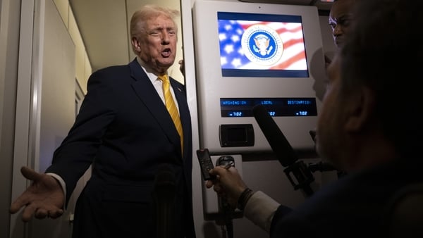 IN FLIGHT - NOVEMBER 14: U.S. President Donald Trump speaks to members of press aboard Air Force One on November 14, 2025 while in flight from Washington, DC to West Palm Beach International Airport. Trump is scheduled to spend the weekend at his Mar-A-La