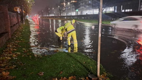 South Dublin Council employees working fixing a blocked drain on the N81 in Tallaght