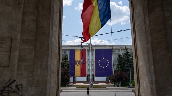 The Moldovan and European Union flags are displayed on the Government House of Moldova
