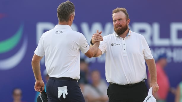 DUBAI, UNITED ARAB EMIRATES - NOVEMBER 15: Justin Rose of England and Shane Lowry of Ireland shake hands after finishing their round on the 18th green on day three of the DP World Tour Championship 2025 at Jumeirah Golf Estates on November 15, 2025 in Dubai, United Arab Emirates. (Photo by Richard H