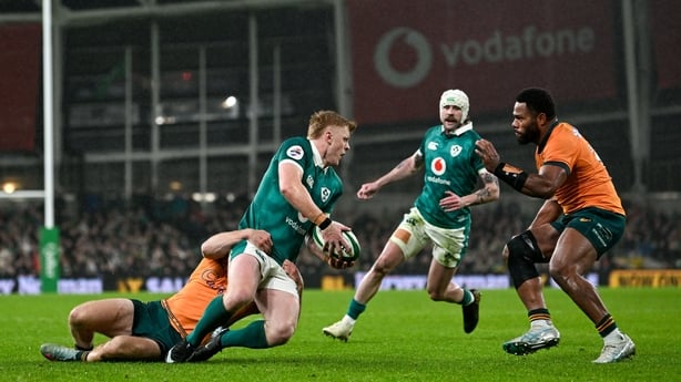 15 November 2025; Tommy O'Brien of Ireland is tackled by Max Jorgensen of Australia during the Quilter Nations Series 2025 match between Ireland and Australia at the Aviva Stadium in Dublin. Photo by Ramsey Cardy/Sportsfile