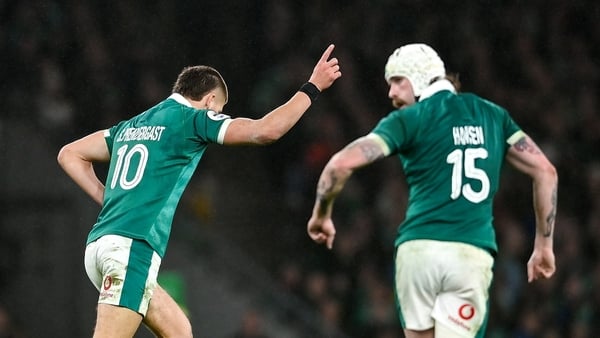 15 November 2025; Sam Prendergast of Ireland celebrates with teammate Mack Hansen after kicking a drop-goal during the Quilter Nations Series 2025 match between Ireland and Australia at the Aviva Stadium in Dublin. Photo by David Fitzgerald/Sportsfile