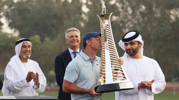 DUBAI, UNITED ARAB EMIRATES - NOVEMBER 16: Rory McIlroy of Northern Ireland kisses the Race to Dubai trophy on the 18th green on day four of the DP World Tour Championship 2025 at Jumeirah Golf Estates on November 16, 2025 in Dubai, United Arab Emirates. (Photo by Luke Walker/Getty Images)