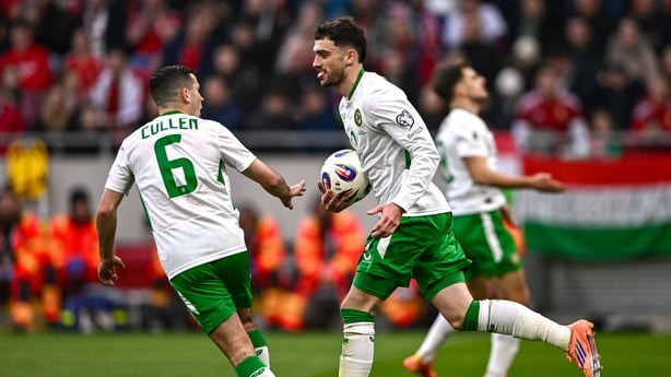 Troy Parrott of Republic of Ireland celebrates after scoring his side's first goal with teammate Josh Cullen, 6, during the FIFA World Cup 2026 Group F Qualifier match between Hungary and Republic of Ireland at Puskás Aréna in Budapest, Hungary. 
