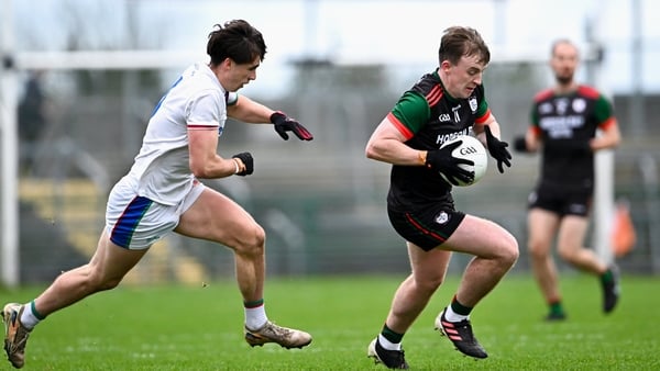 16 November 2025; Ciarán Sugru of St Brigid's in action against Sam Callinan of Ballina Stephenites during the AIB Connacht GAA Football Senior Club Championship semi-final match between St Brigid's and Ballina Stephenites at King & Moffatt Dr Hyde Park i
