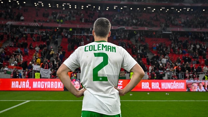 Seamus Coleman surveys the away support after Ireland pull off a miraculous win in Budapest