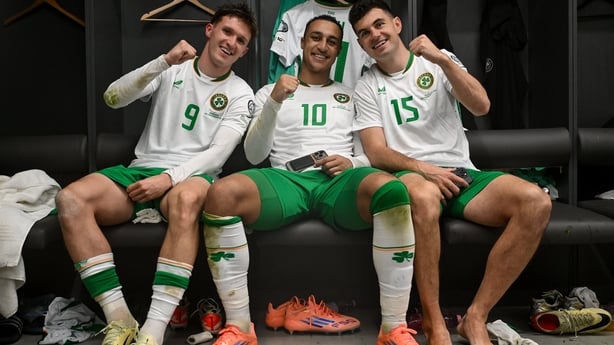 Johnny Kenny, Adam Idah and John Egan of Republic of Ireland celebrate in the dressing room after the FIFA World Cup 2026 Group F Qualifier match between Hungary and Republic of Ireland at Puskás Aréna in Budapest, Hungary.