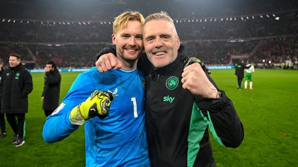 Republic of Ireland goalkeeper Caoimhin Kelleher and Republic of Ireland goalkeeping coach Gudmundur Hreidarsson celebrate after the FIFA World Cup 2026 Group F Qualifier match between Hungary and Republic of Ireland at Puskás Aréna in Budapest, Hungary.