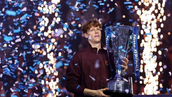 Winner Jannik Sinner of Italy lifts his trophy following the Men's Singles Final against Carlos Alcaraz of Spain on day eight of the Nitto ATP Finals 2025 at Inalpi Arena on November 16, 2025 in Turin, Italy.