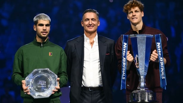 (From L) Spain's Carlos Alcaraz, ATP's President Andrea Gaudenzi and Italy's Jannik Sinner pose during the trophy ceremony at the end of the men's single final match at the ATP Finals tennis tournament, in Turin, on November 16, 2025.
