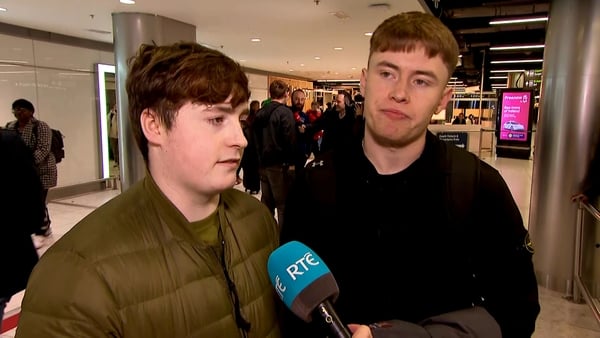 RTE News reporter speaks to two Ireland fans in Dublin Airport