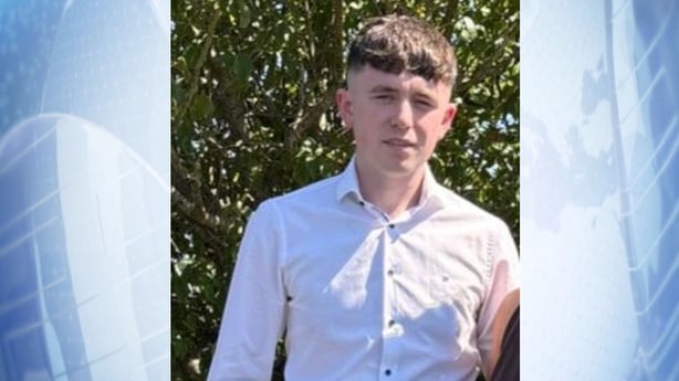 A photograph on a blue background of shay duffy