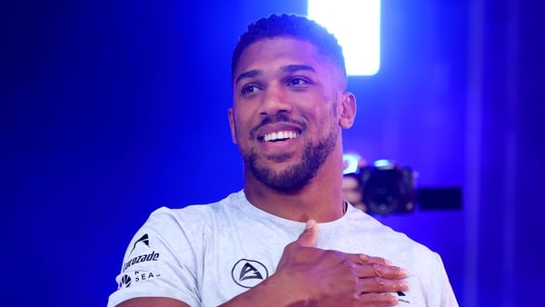 LONDON, ENGLAND - SEPTEMBER 20: Anthony Joshua gestures to the crowd during a weigh-in as part of the Riyadh Season - Wembley Edition card at Trafalgar Square on September 20, 2024 in London, England. (Photo by Richard Pelham/Getty Images)