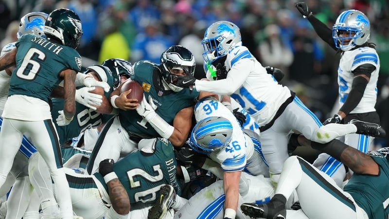 Detroit Lions cornerback Amik Robertson (21) grabs Philadelphia Eagles quarterback Jalen Hurts (1) during the second half