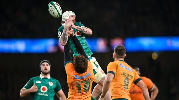 Mack Hansen takes to the air to gather over Australian out-half James O'Connor