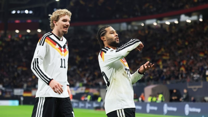 Serge Gnabry of Germany celebrates scoring his team's second goal with team mate Nick Woltemade