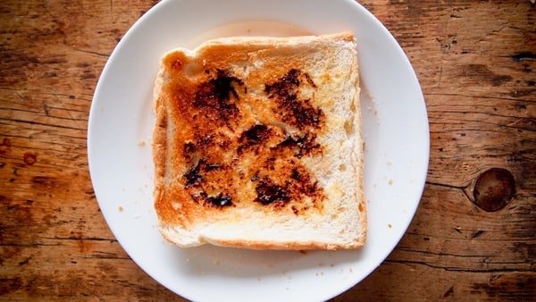 A slice of toasted bread with a brown coloured spread
