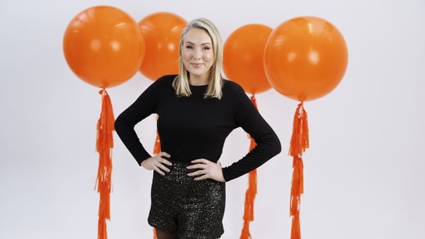 Tracy Clifford poses with balloons in a promotional shot for her 2fm show