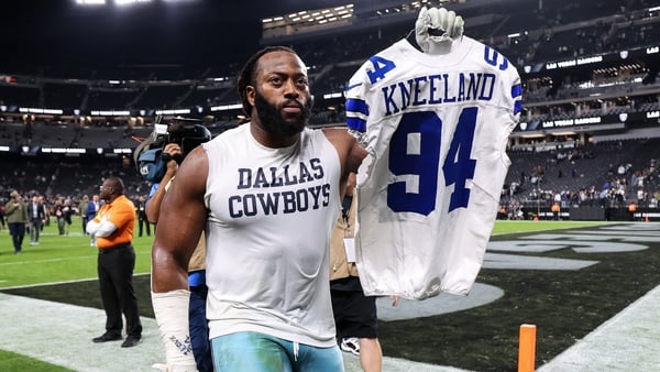 LAS VEGAS, NEVADA - NOVEMBER 17: Osa Odighizuwa #97 of the Dallas Cowboys walks off the field holding a number 94 jersey in remembrance of Marshawn Kneeland after after the game against the Las Vegas Raiders at Allegiant Stadium on November 17, 2025 in La